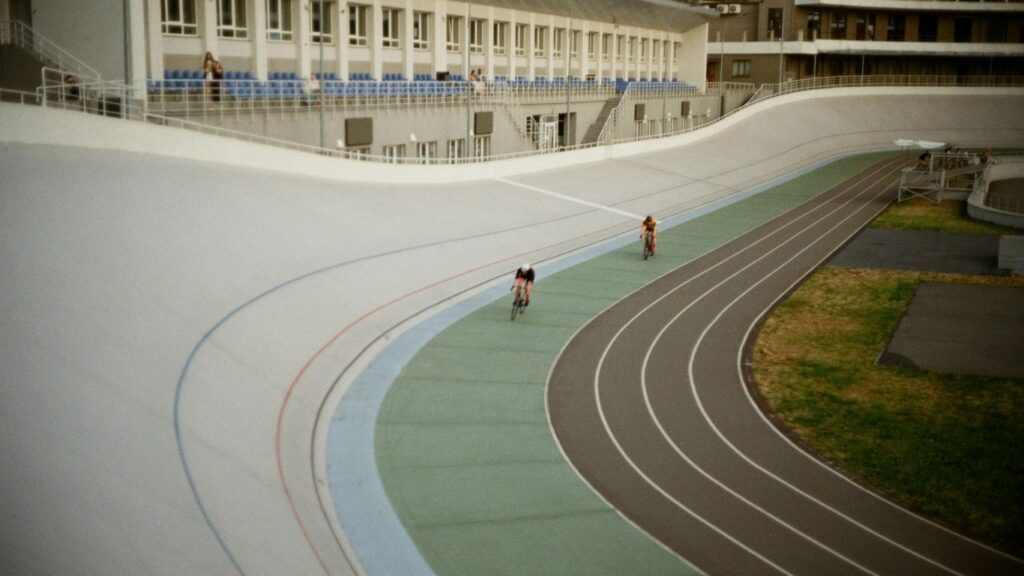 people playing basketball on field during daytime