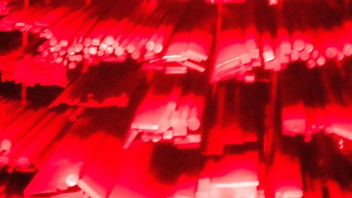 Rows of metal bars illuminated in red light