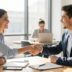 Confident business handshake in bright office meeting