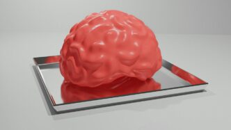 A red brain sitting on top of a metal tray