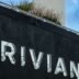 The rivian logo is displayed on a building.