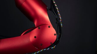 a close up of a red bike with a black background