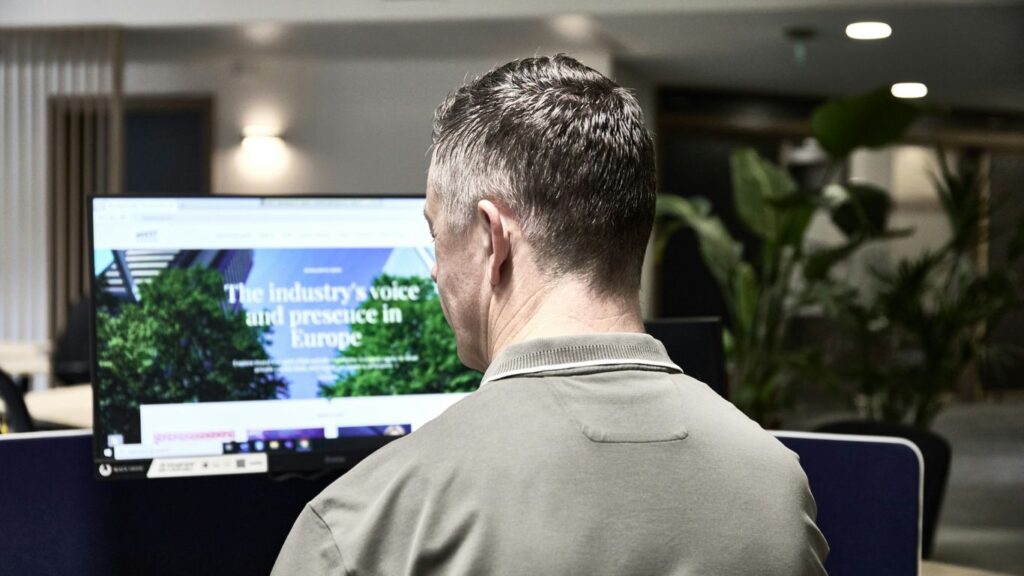 Man working on a computer in an office.