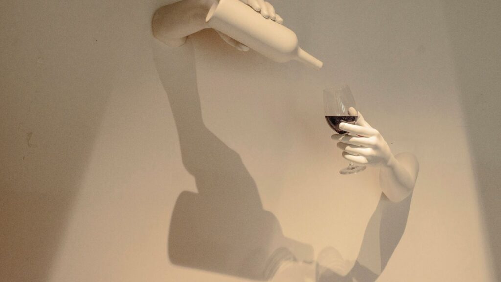 person holding white plastic cup