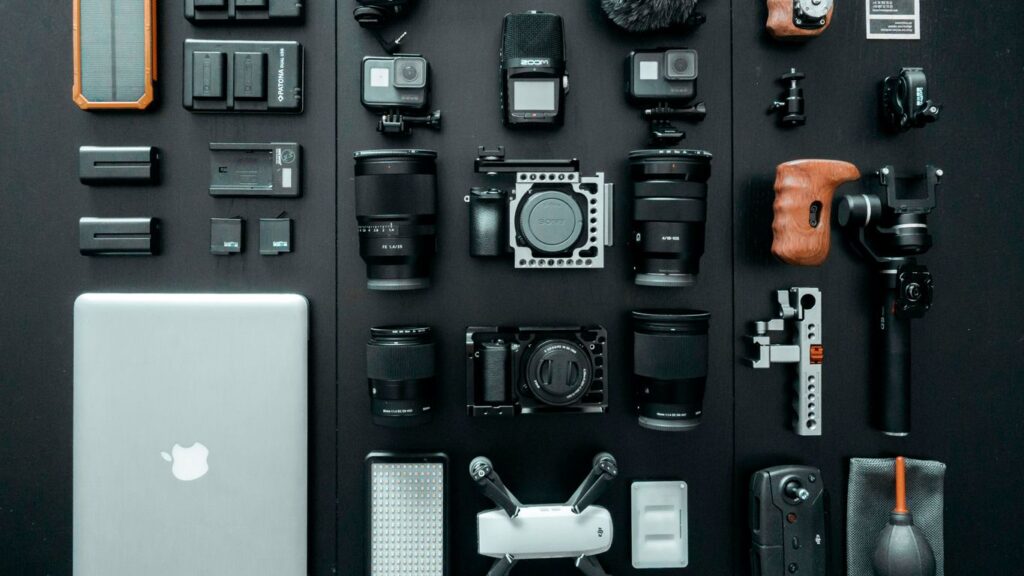 silver MacBook beside battery charger