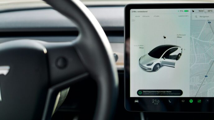 a car dashboard with a screen and a steering wheel