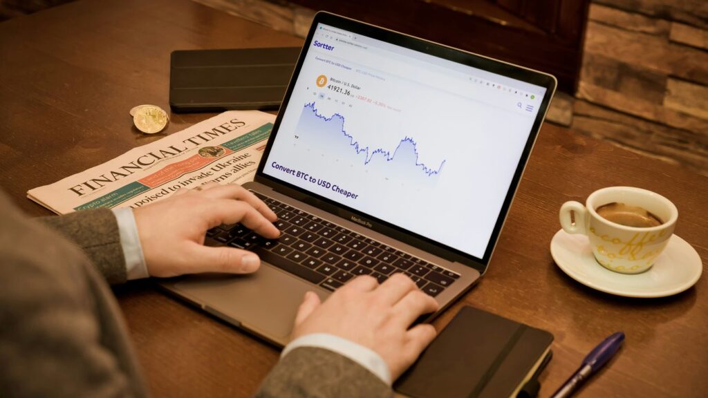 a person typing on a laptop on a table