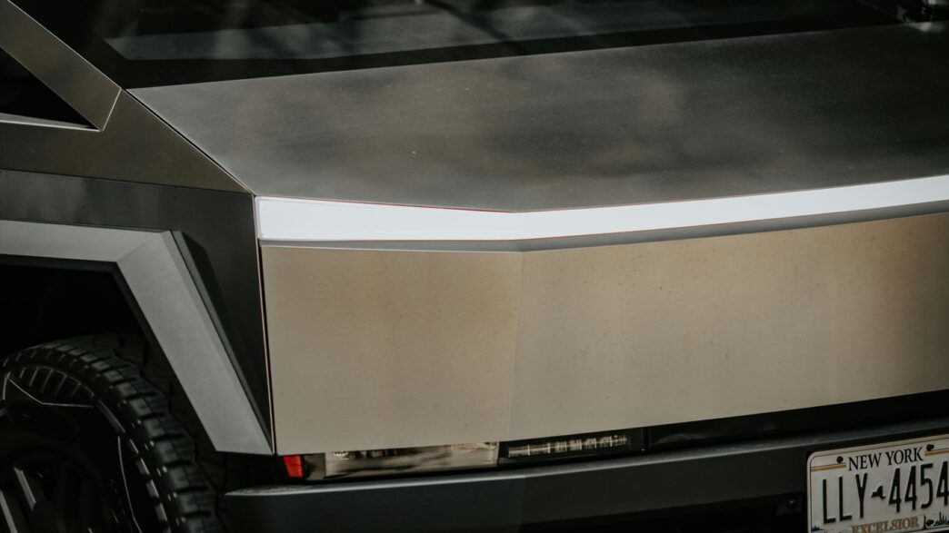 A silver vehicle parked in front of a building