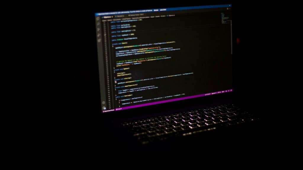 a laptop computer sitting on top of a table