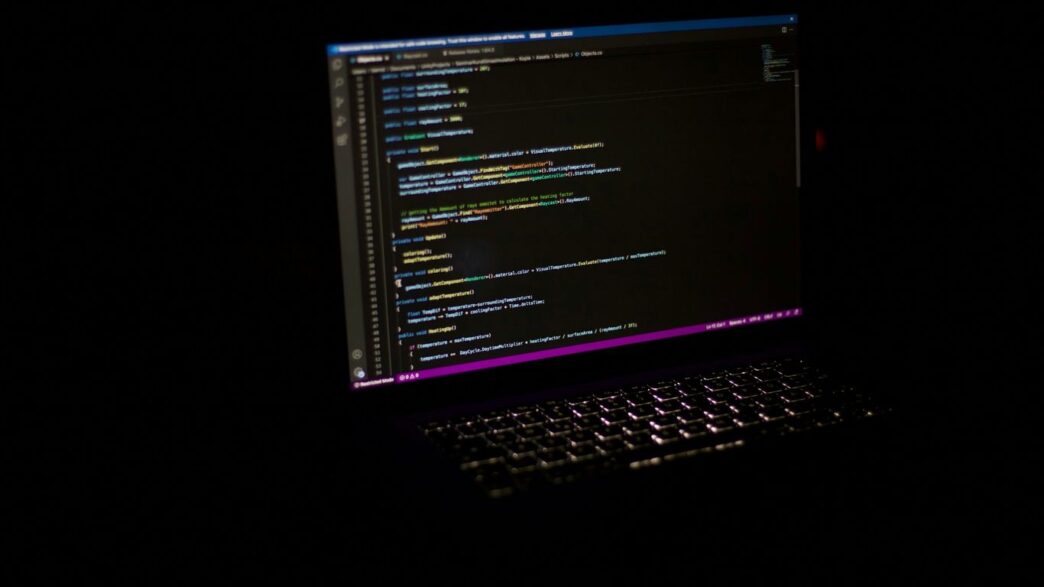 a laptop computer sitting on top of a table