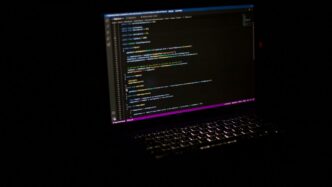 a laptop computer sitting on top of a table