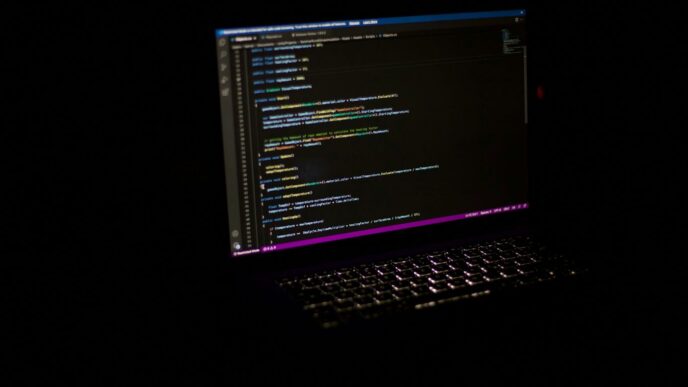 a laptop computer sitting on top of a table