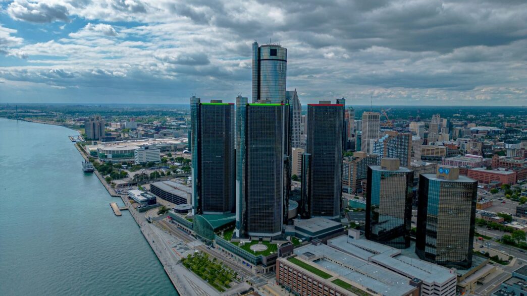 an aerial view of a city and a body of water