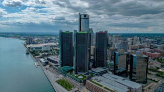 an aerial view of a city and a body of water