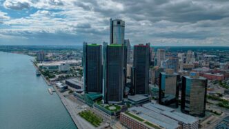 an aerial view of a city and a body of water