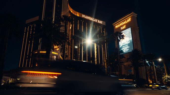 a bus driving down a street next to a tall building