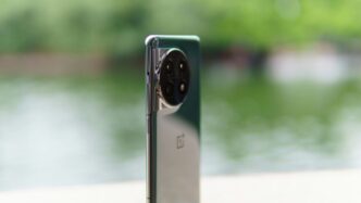 a close up of a cell phone near a body of water