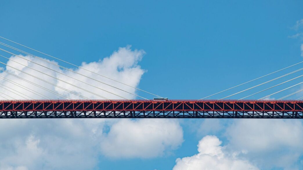 a bridge with a train going over it