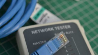 A close up of a network tester on a table