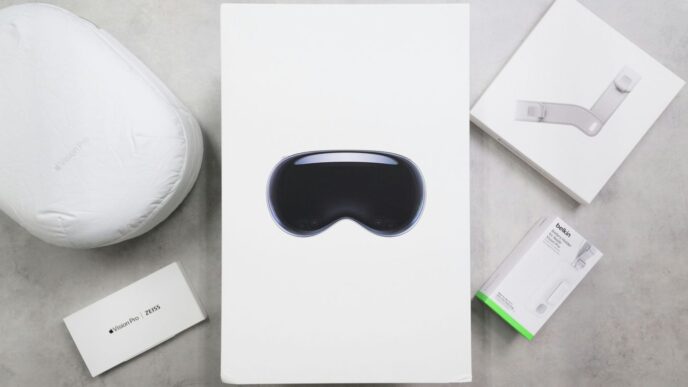 Virtual reality headset packaging and accessories on a surface.