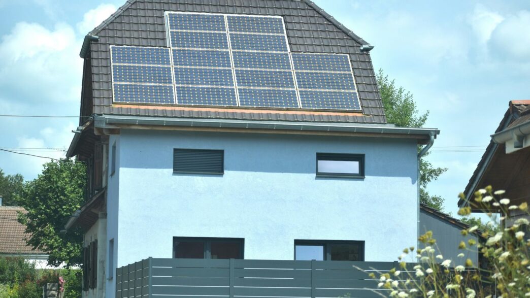 A house with a solar panel on the roof