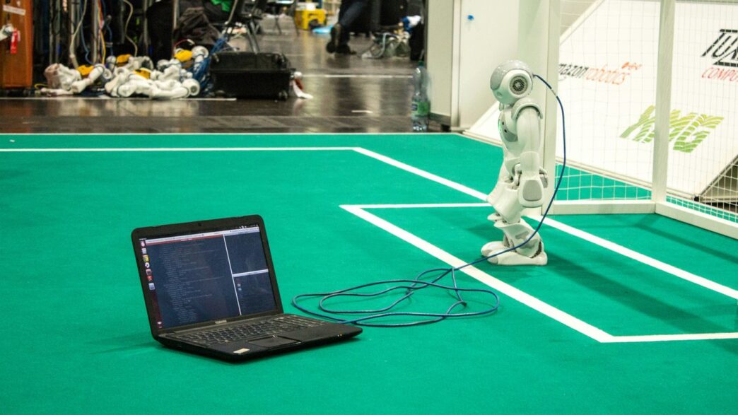 black tablet computer on green table