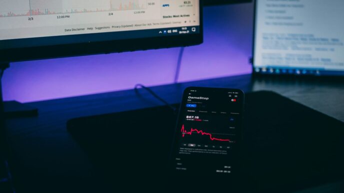 black android smartphone on black laptop computer