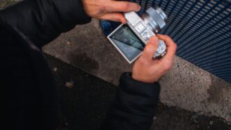 a person holding a cell phone in their hand