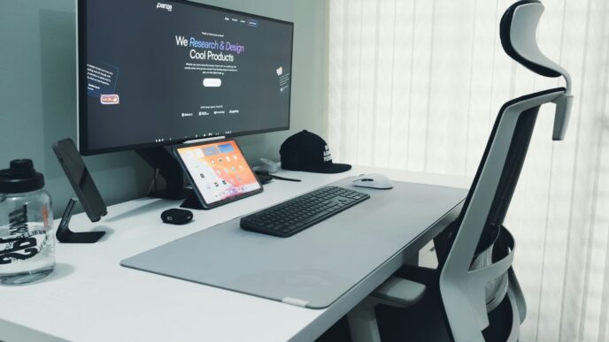 Modern desk setup with computer and ergonomic chair