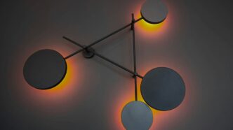 a clock with three circular lights on it