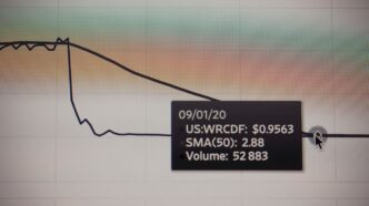 a black sign with a price tag on it