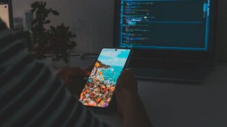 person holding white and blue card