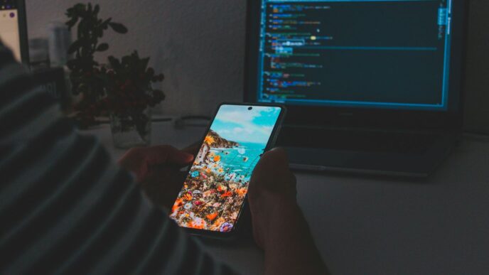 person holding white and blue card