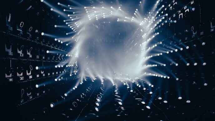 a dark room filled with lots of white lights