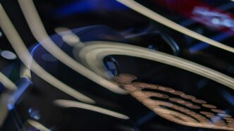 Abstract swirling lines and shapes on dark background