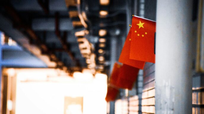 a chinese flag hanging from the side of a building