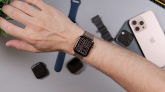 Person wearing a smartwatch with iPhone and bands