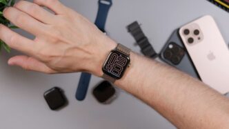 Person wearing a smartwatch with iPhone and bands