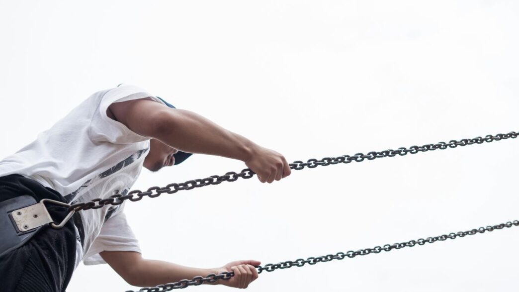 man sitting on swing chair