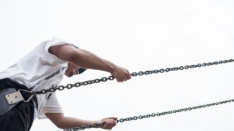 man sitting on swing chair