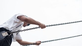 man sitting on swing chair