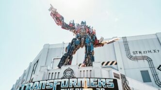 man in red and black suit statue