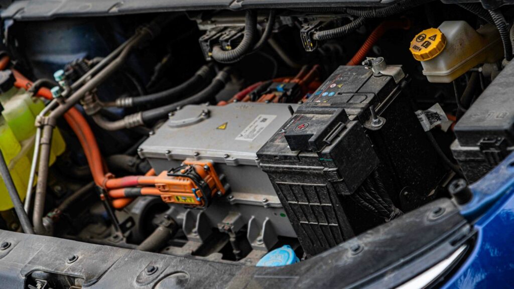 Electric car engine with visible wiring and battery components