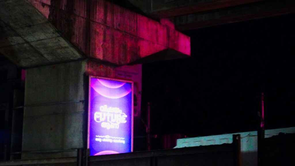 Bright advertisement sign glows at night