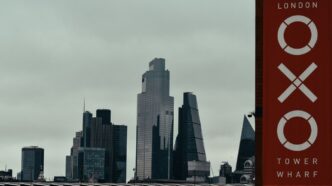 a city skyline with a sign