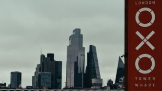 a city skyline with a sign