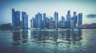 gray buildings near body of water at daytime