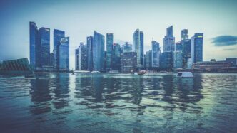 gray buildings near body of water at daytime