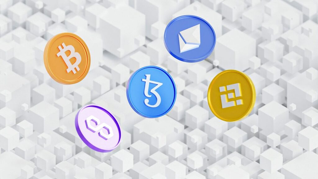 a group of colorful bitcoins sitting on top of a white background