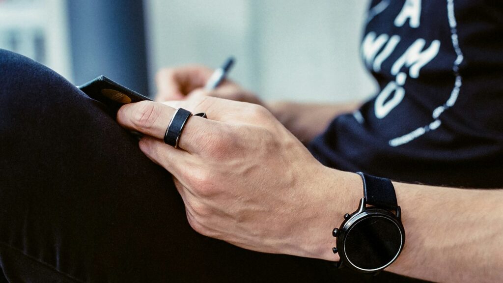 a person writing on a blackboard